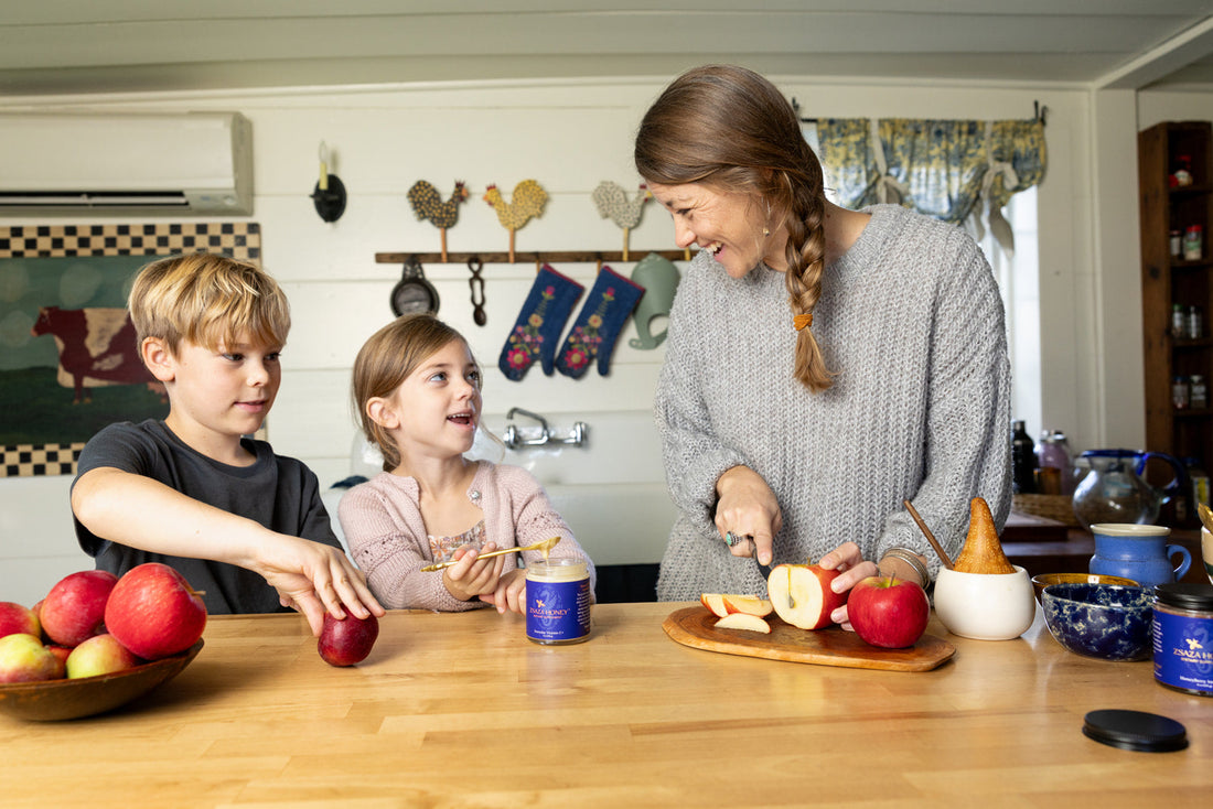 Founder Leilani Mcneill with her children in kitchen sharing ZSAZA HONEY